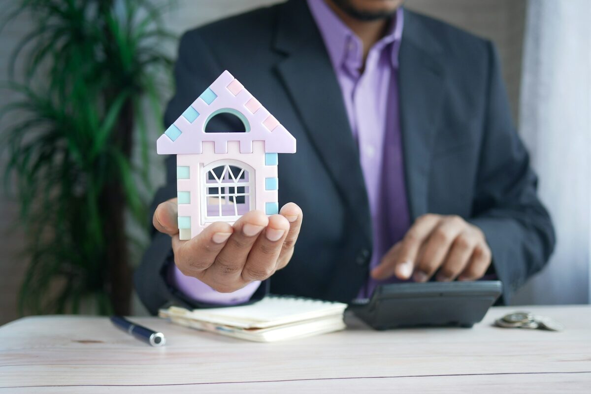 Real estate keys and home document on a desk